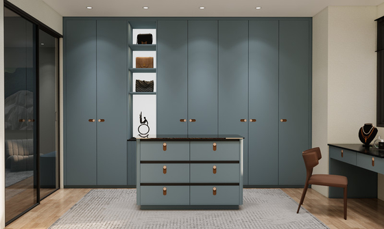 Blue Grey Custom Walk In Closet With Multi Drawer Island And Black Mirrored Vanity